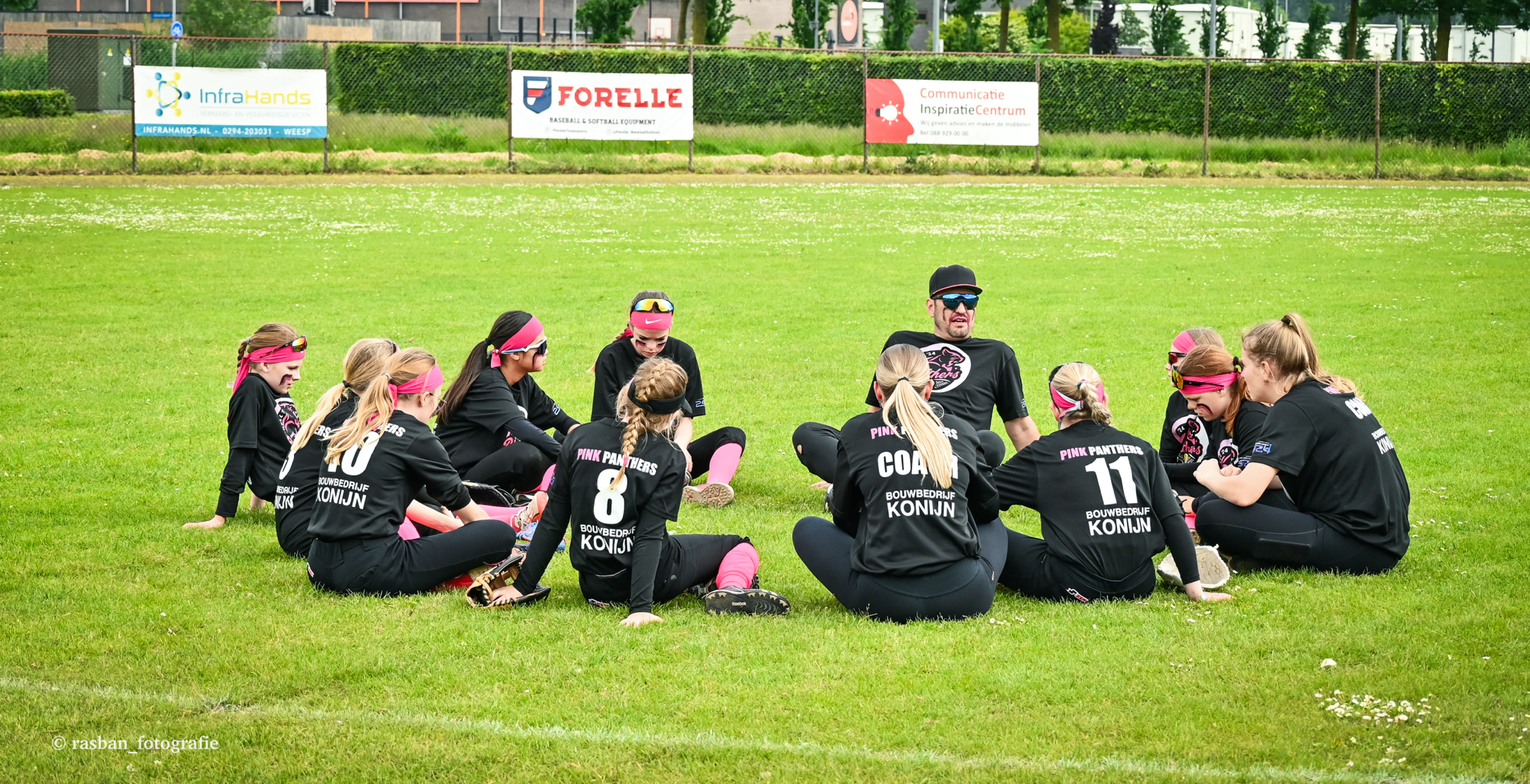 New volunteer coach learning at a youth baseball field