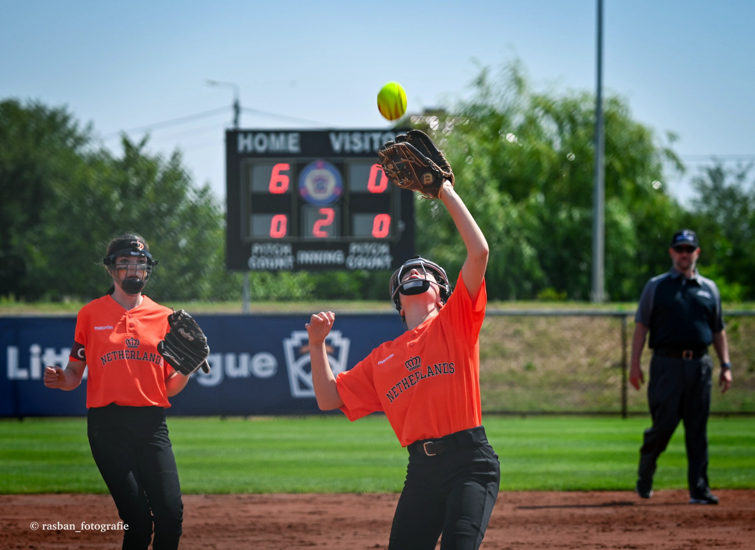 Little League catcher in position behind home plate