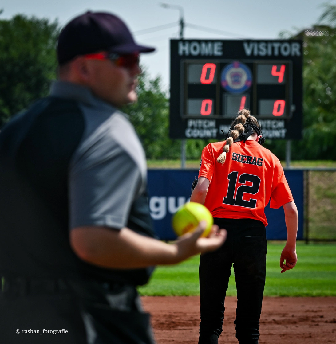 Travel ball player at a showcase event being evaluated